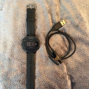Garmin Black Forerunner 235 with charger